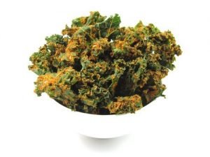 kale chips paprika in white bowl with white background